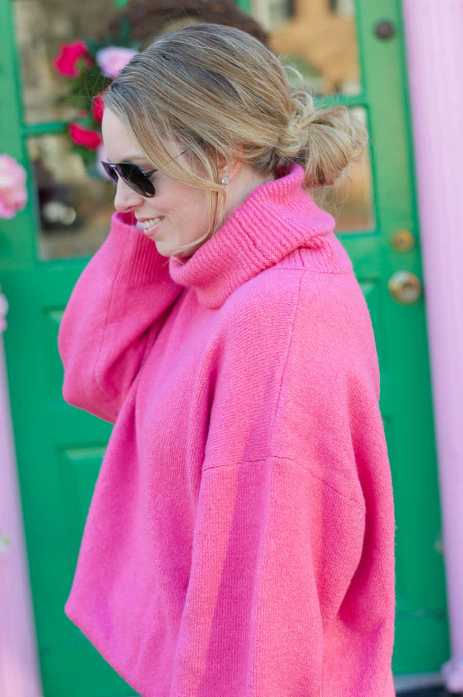 Woman Wearing Cozy Pink Sweater Wallpaper