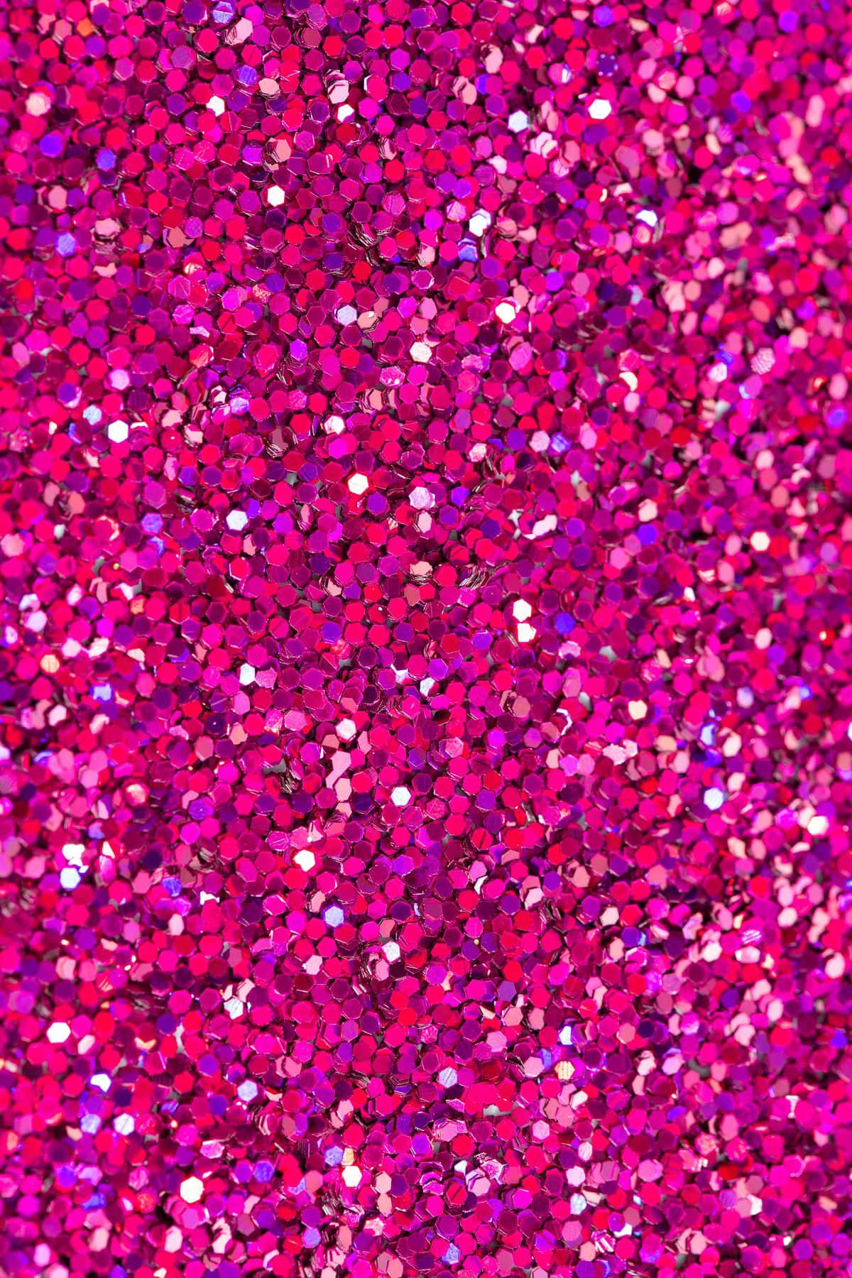 A Close Up Of A Pink Glitter Background