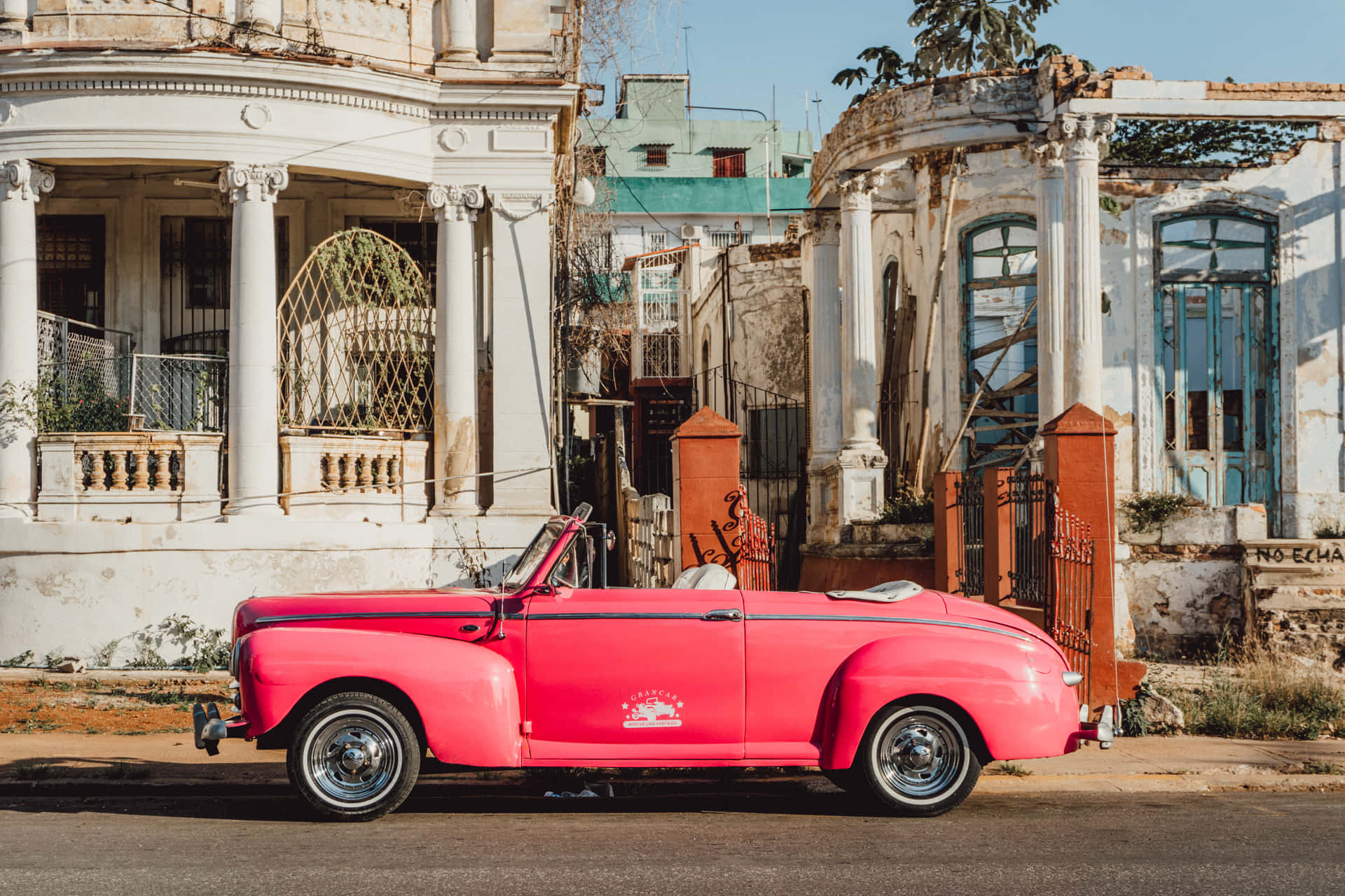 Retro and Stylish - A Breathtaking Pink Vintage Car Wallpaper