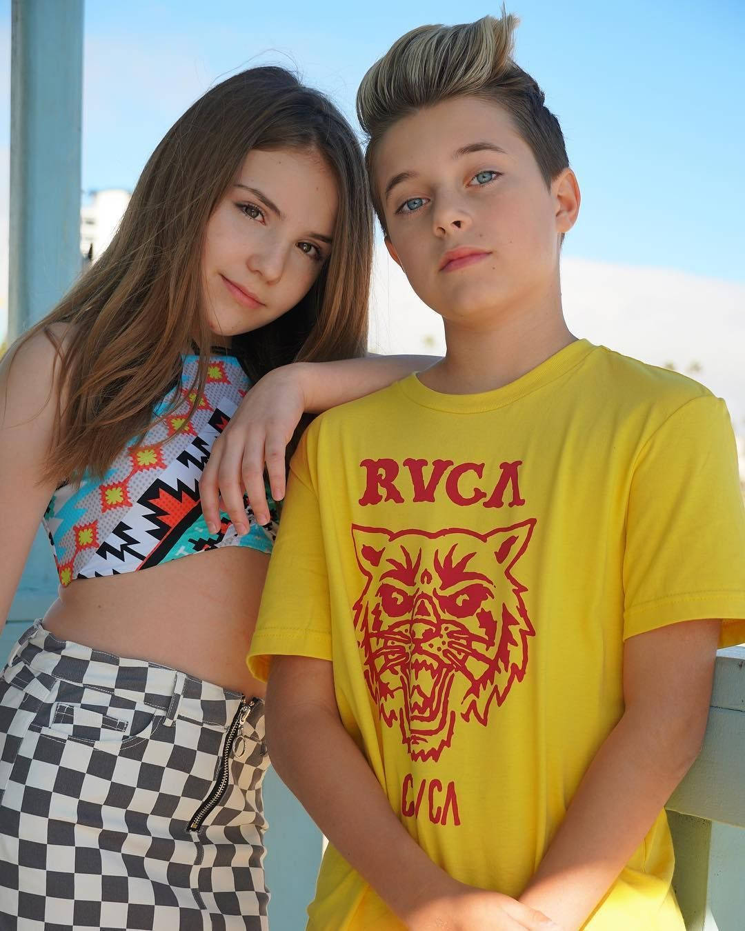 A Boy And Girl Posing For A Photo Wallpaper