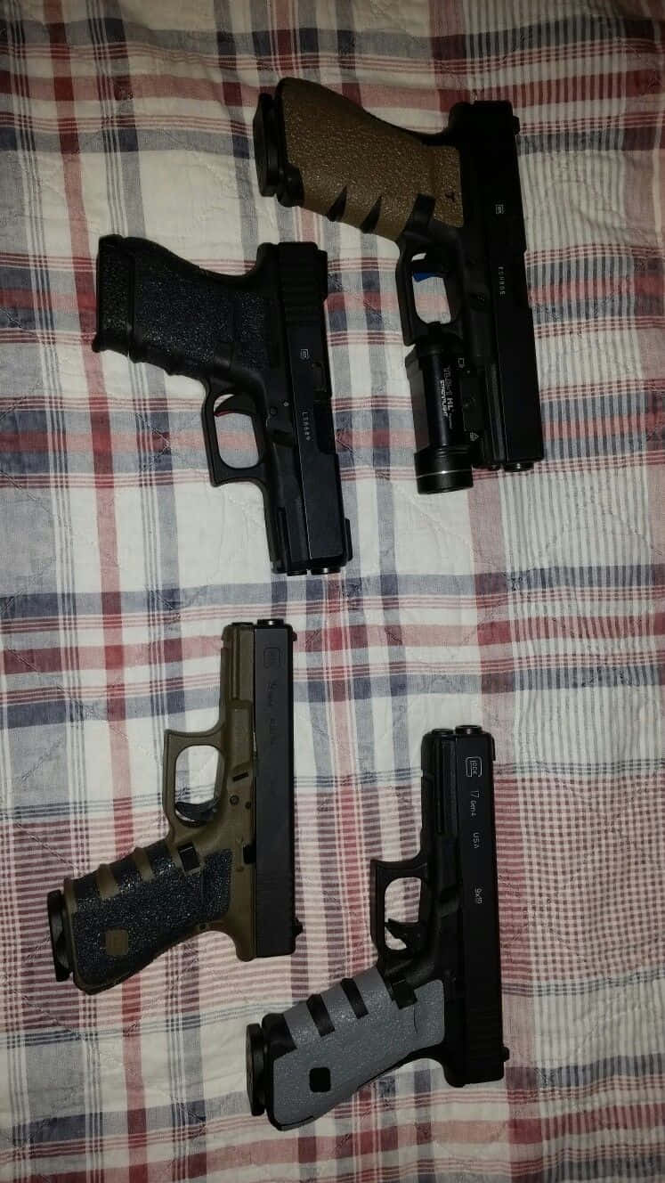 Four Pistol On Plaid Picture