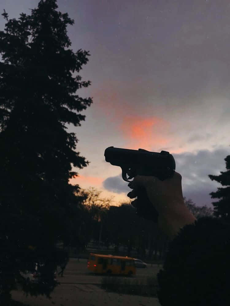 Immaginedi Una Pistola In Silhouette.