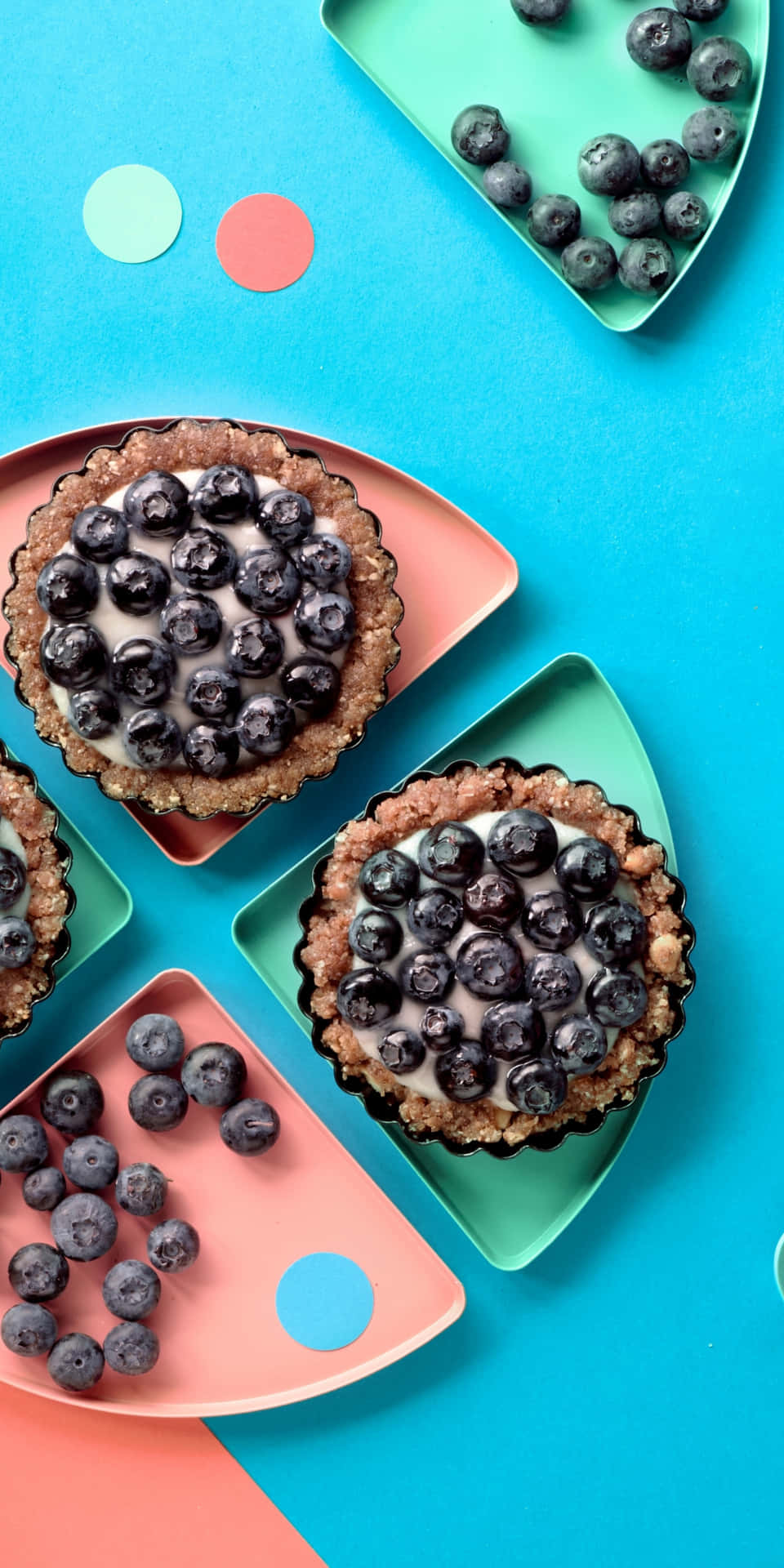 Blueberry Tarts On Colorful Plates