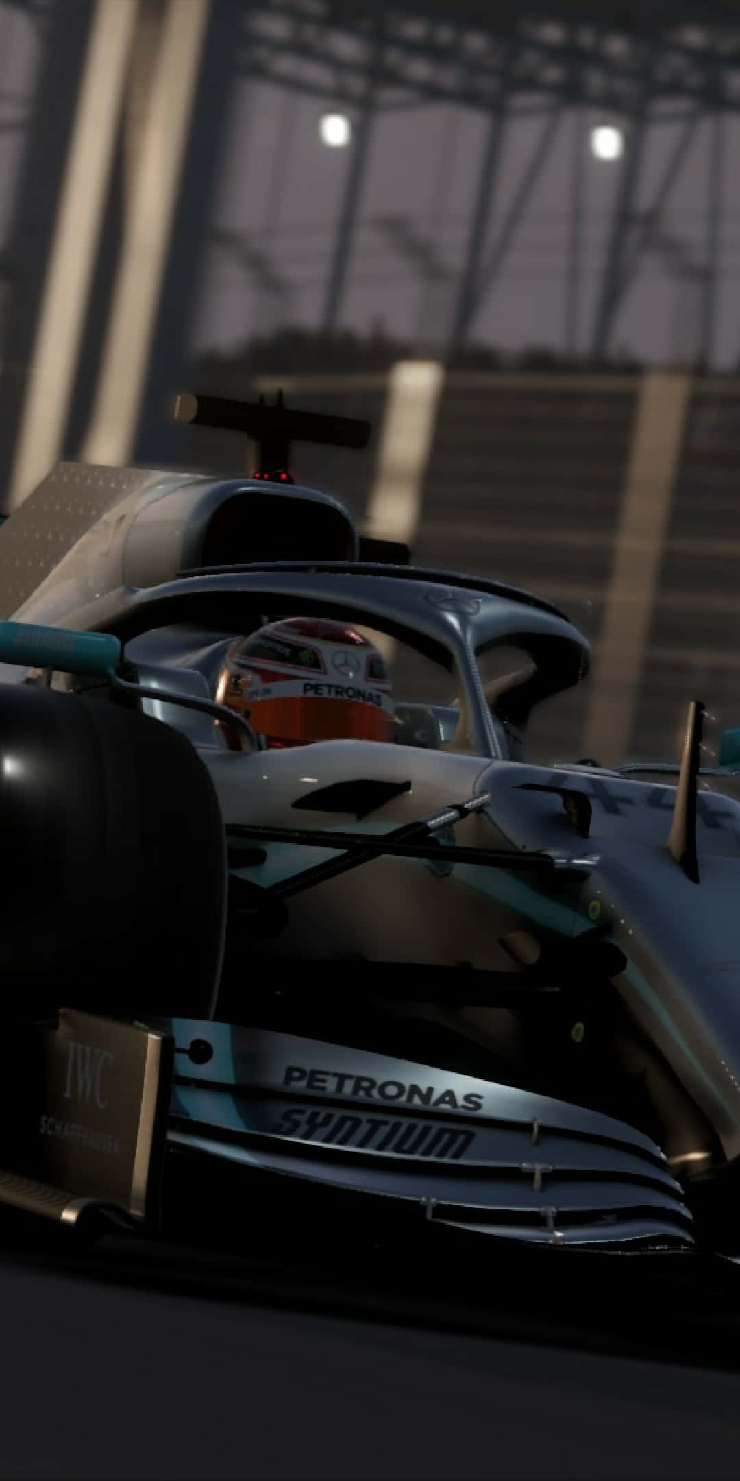 A Mercedes F1 Car Driving On A Track