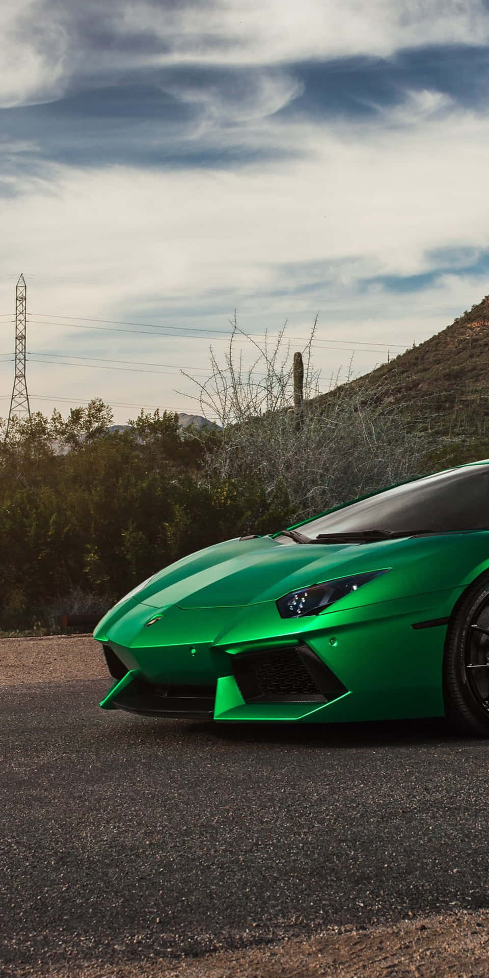 a green lamborghini parked on the side of the road