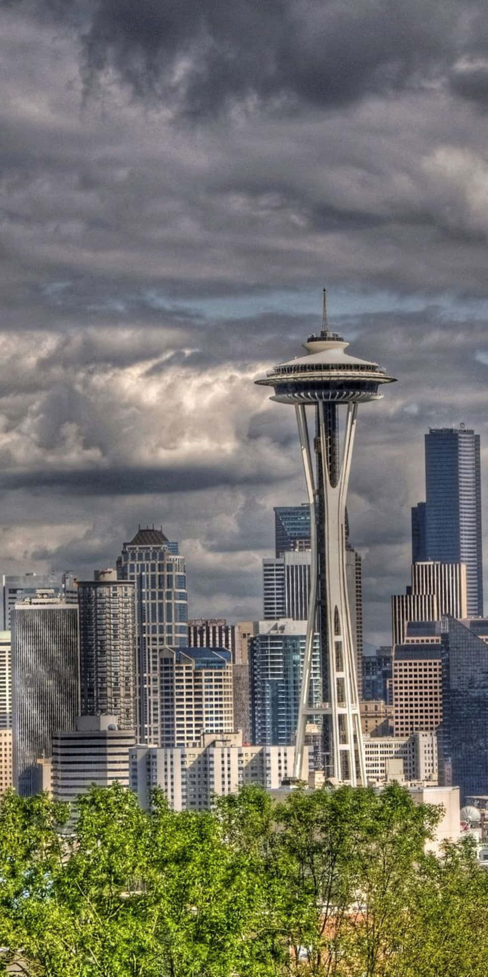 The Space Needle Is Seen In The Background Of A City