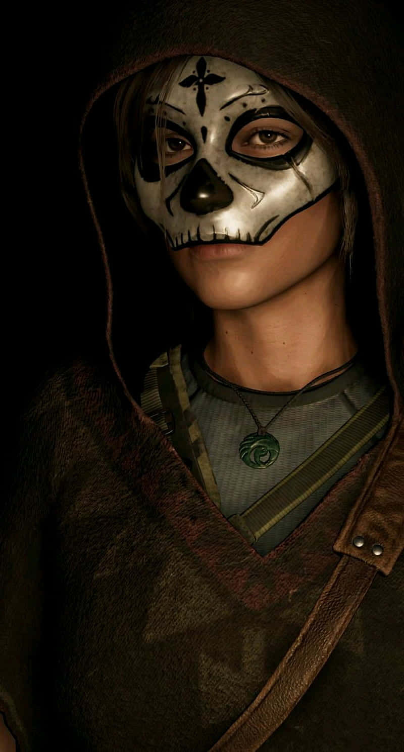 A Woman Wearing A Hooded Mask And A Skeleton Mask