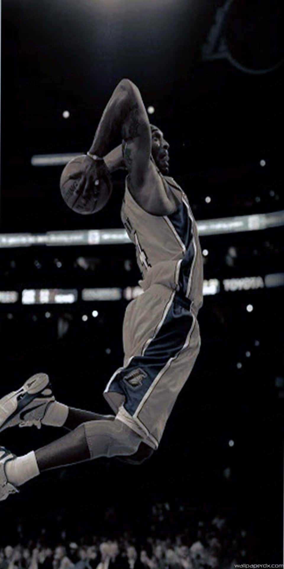 A Basketball Player In The Air