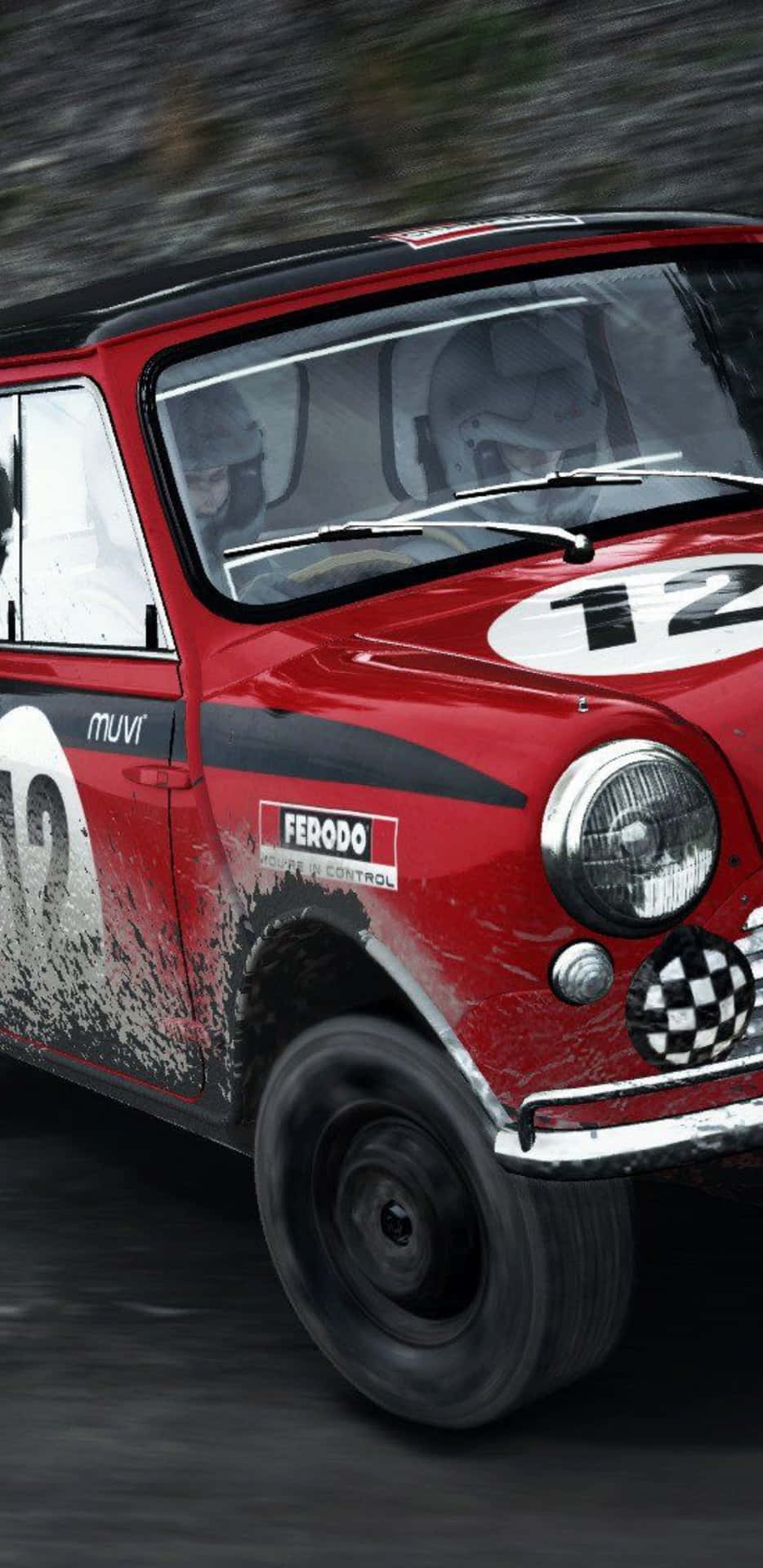 A Red Mini Cooper Is Driving Down A Hill