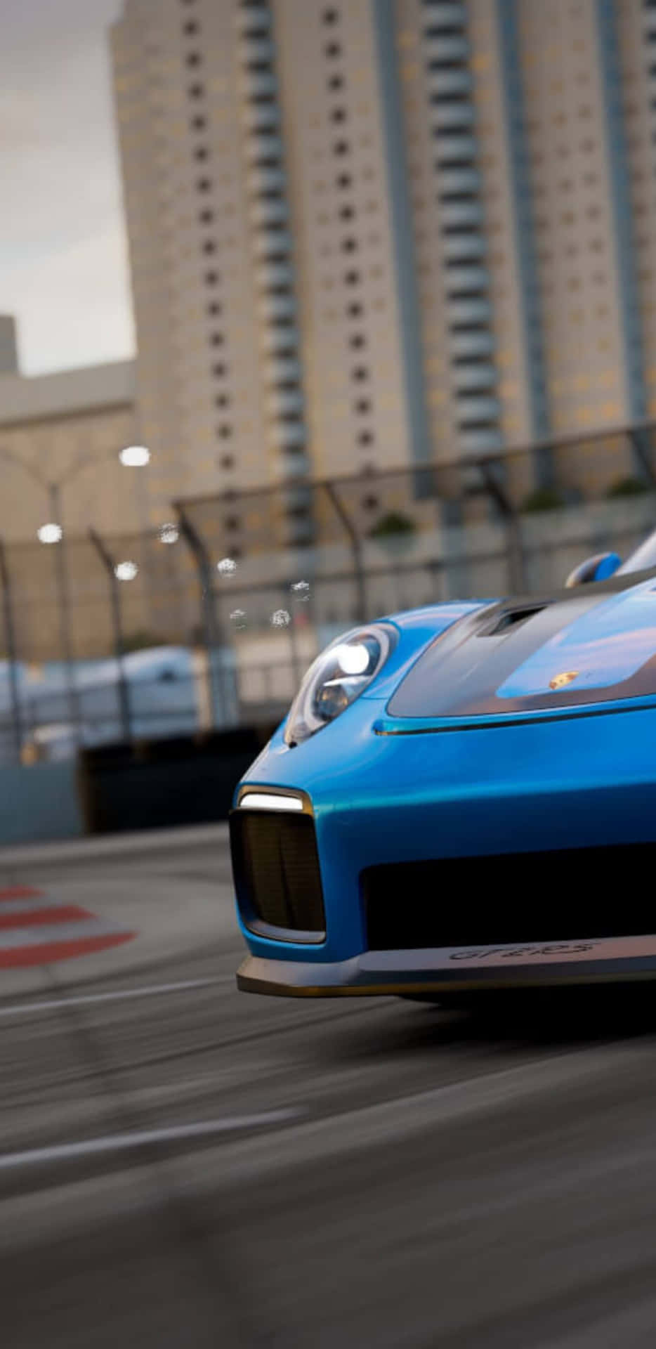 Enblå Porsche 911 Gt3 Som Tävlar På En Bana