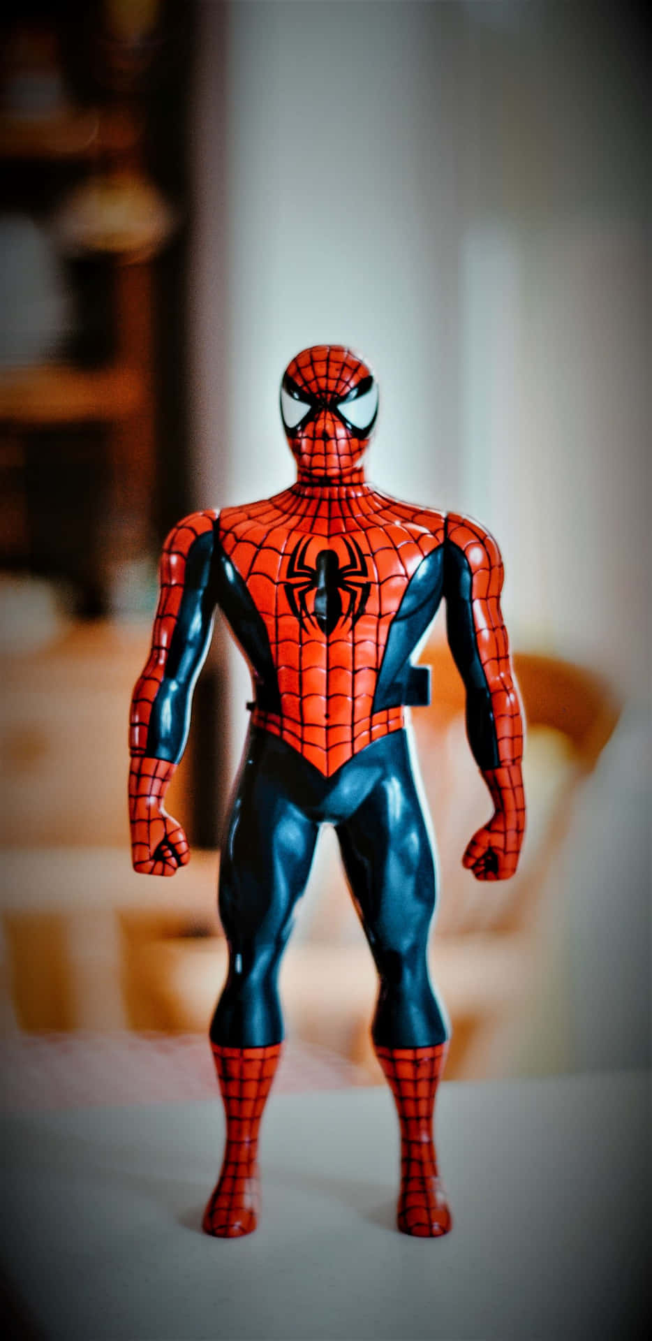 Pixel3xl Marvel Bakgrund Spiderman-leksak På Ett Bord.