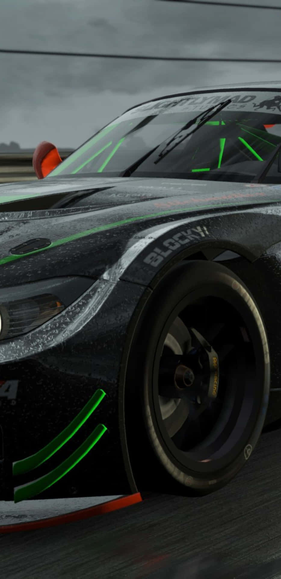 a black and green racing car in a rainy scene