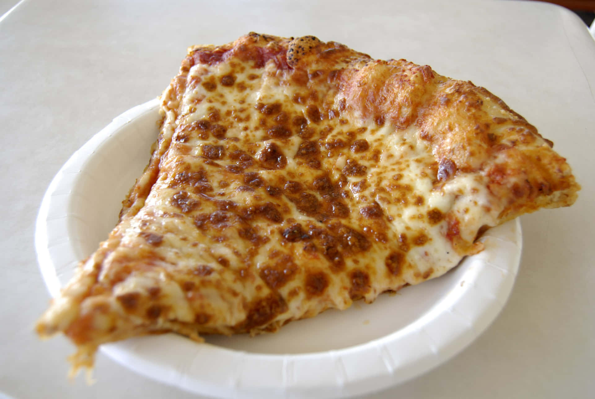 Pizza Cheese On White Paper Plate Picture