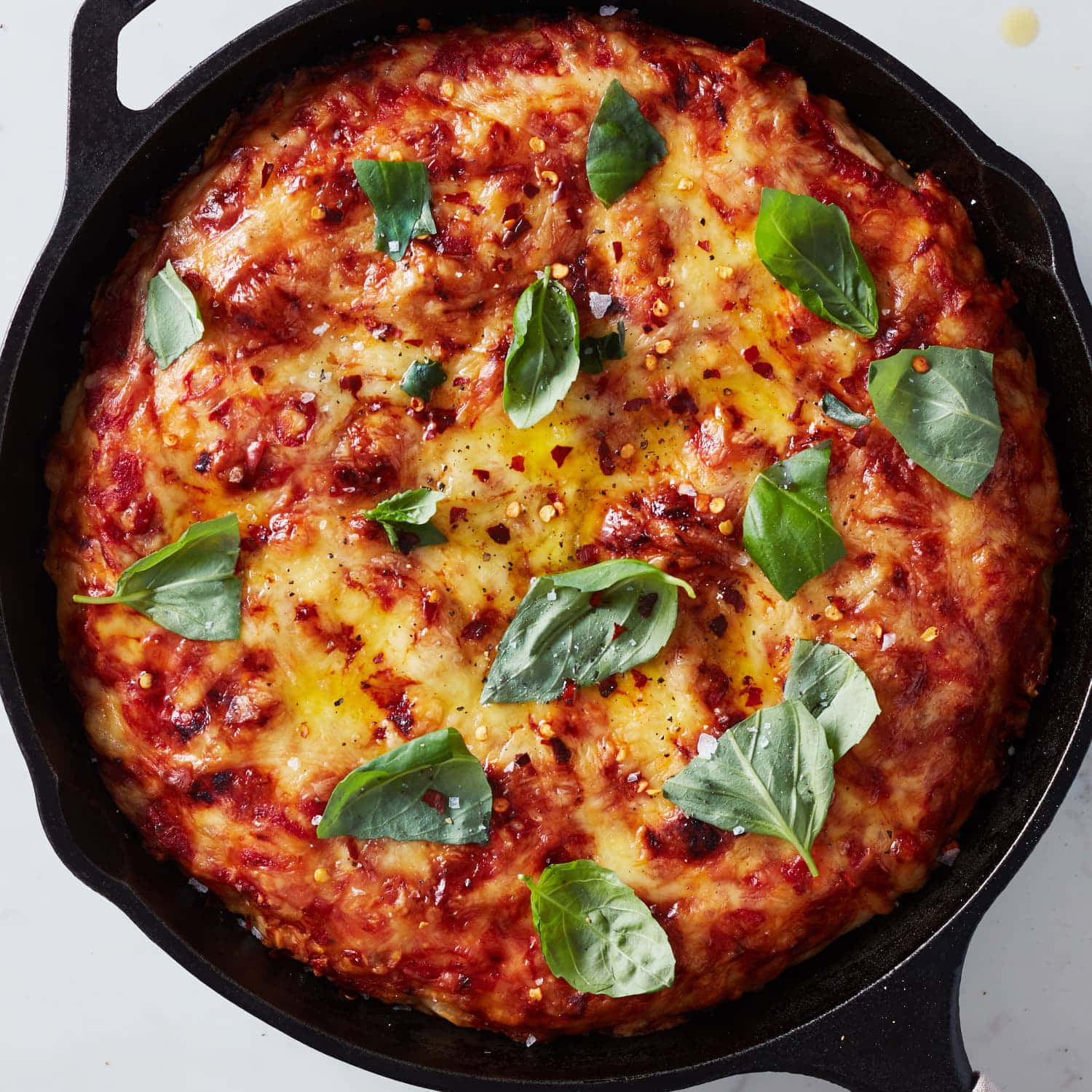 Pizza On Pan With Basil Leaves Picture