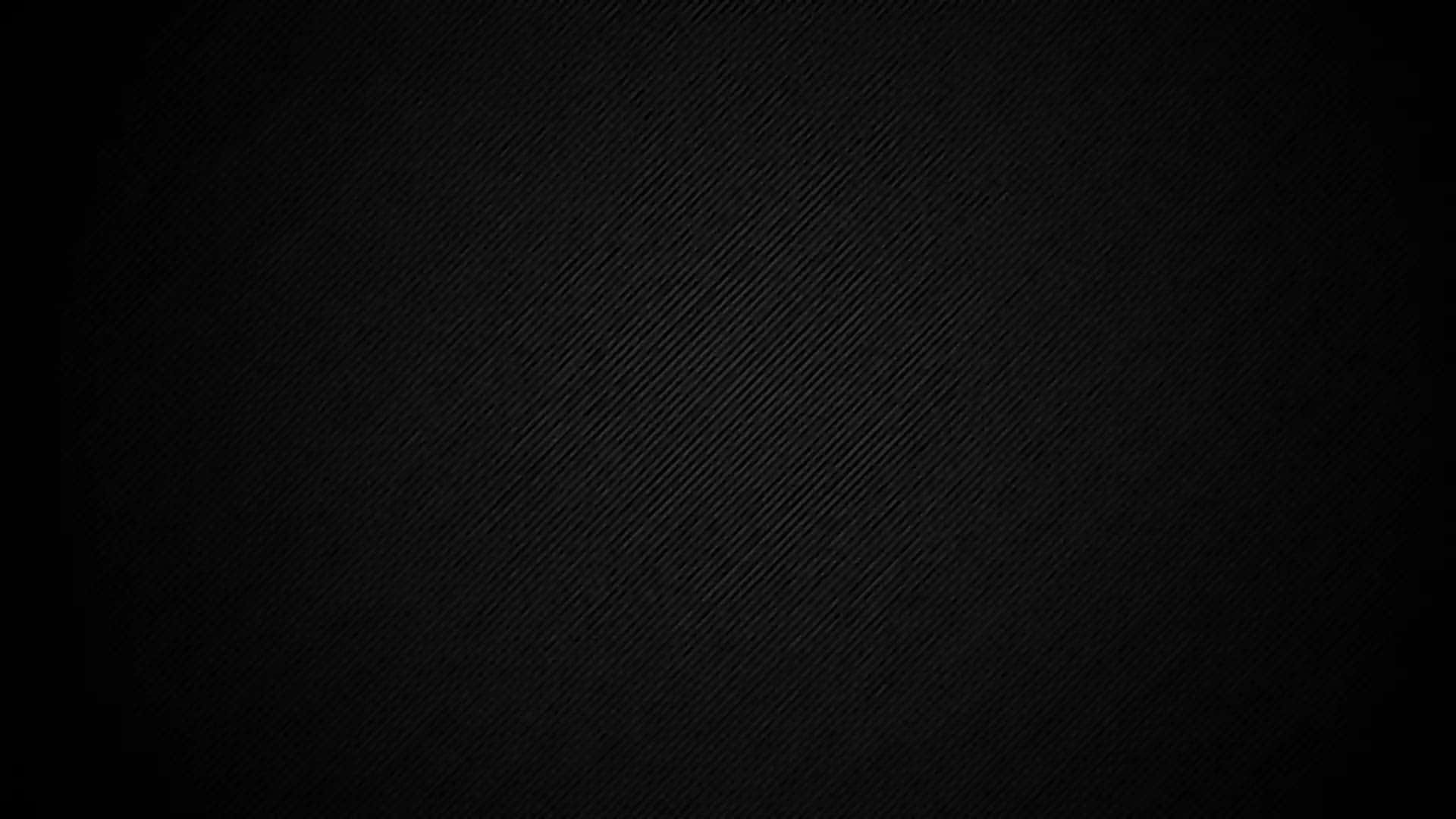 A Black Background With A Light Shining On It Wallpaper