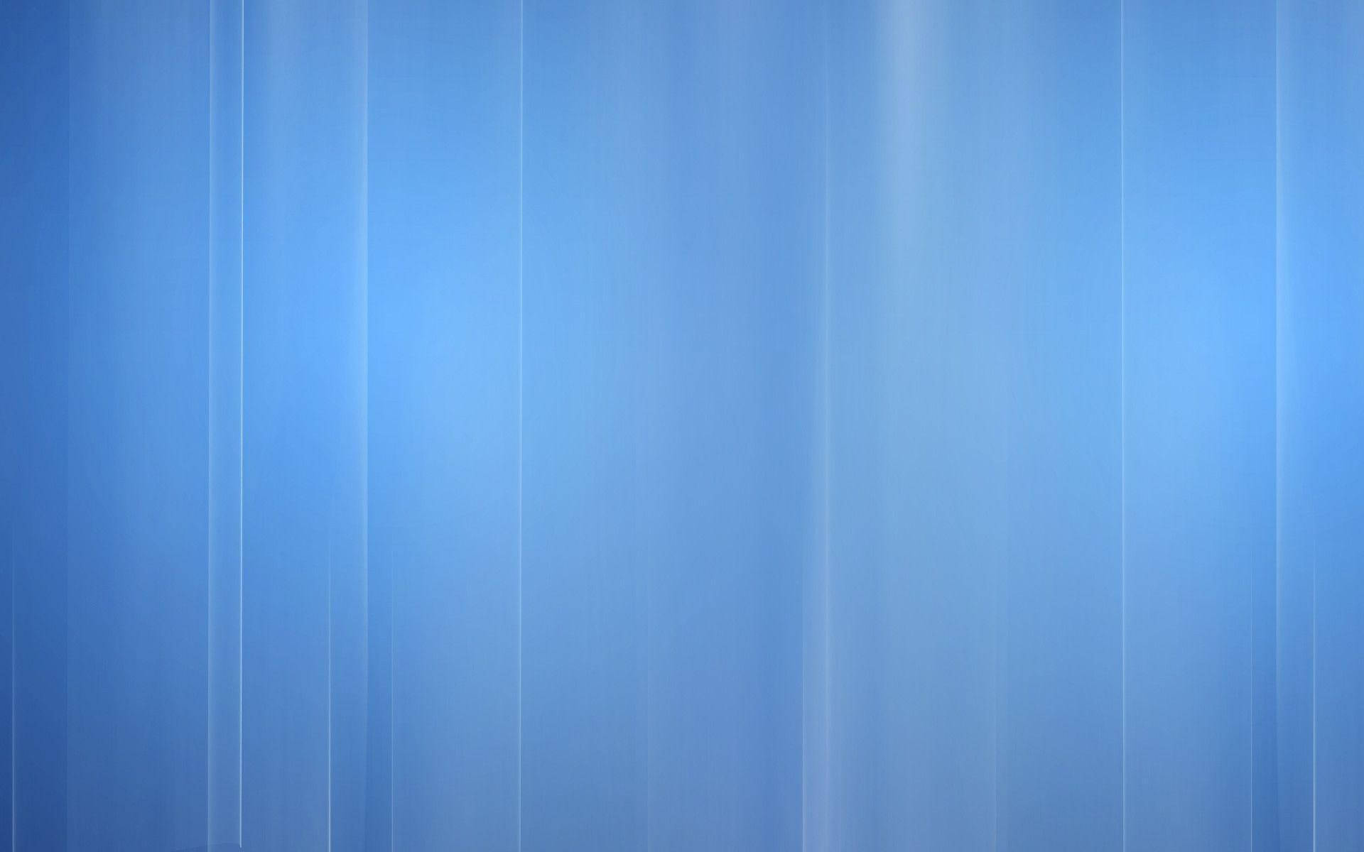 A vibrant abstract glitch pattern on a soft blue background. Wallpaper