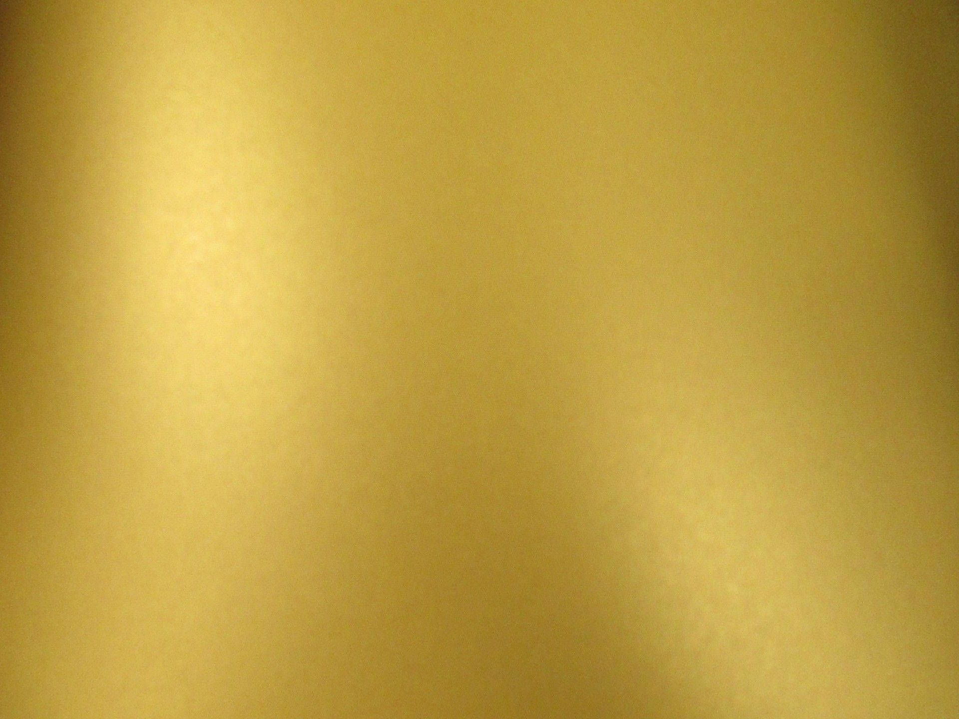 Plain Gold Background With Lighting Wallpaper