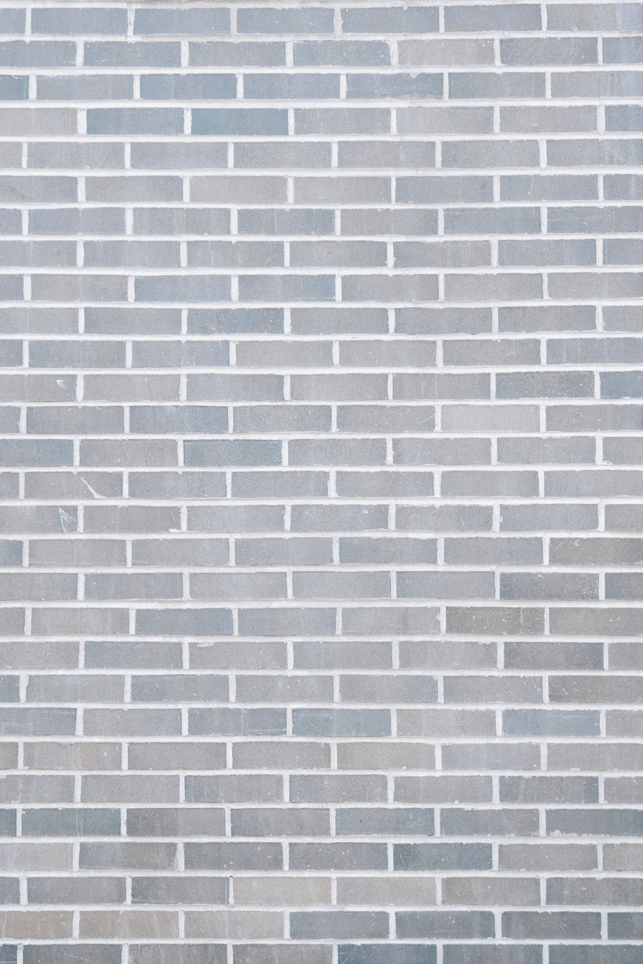 Plain Grå Brick Wall Portræt Wallpaper