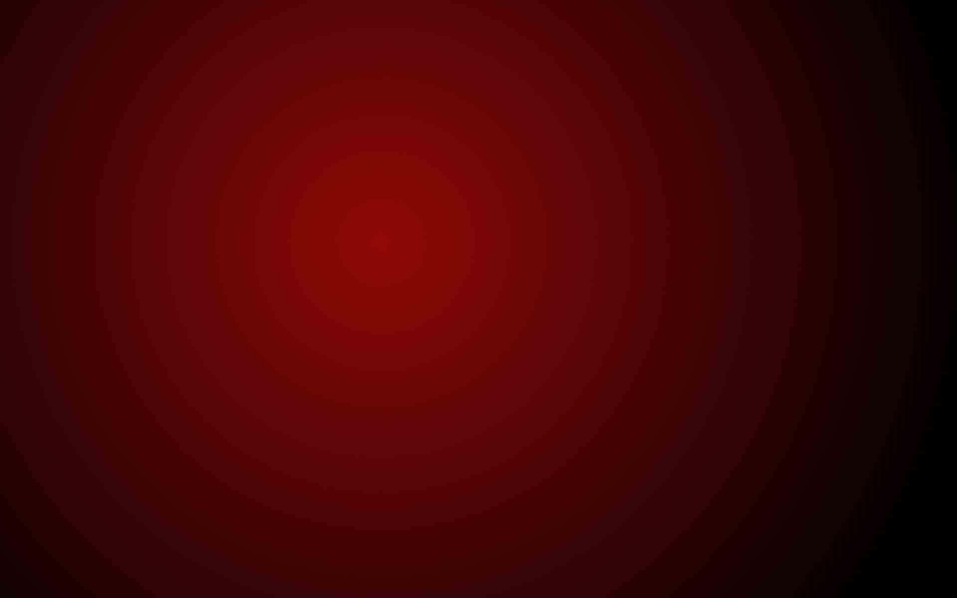 A Red Background With A Black Circle