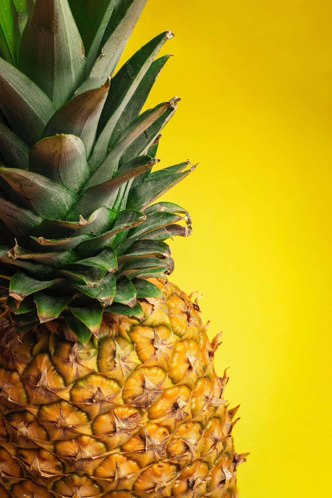 A Pineapple Is Shown On A Yellow Background