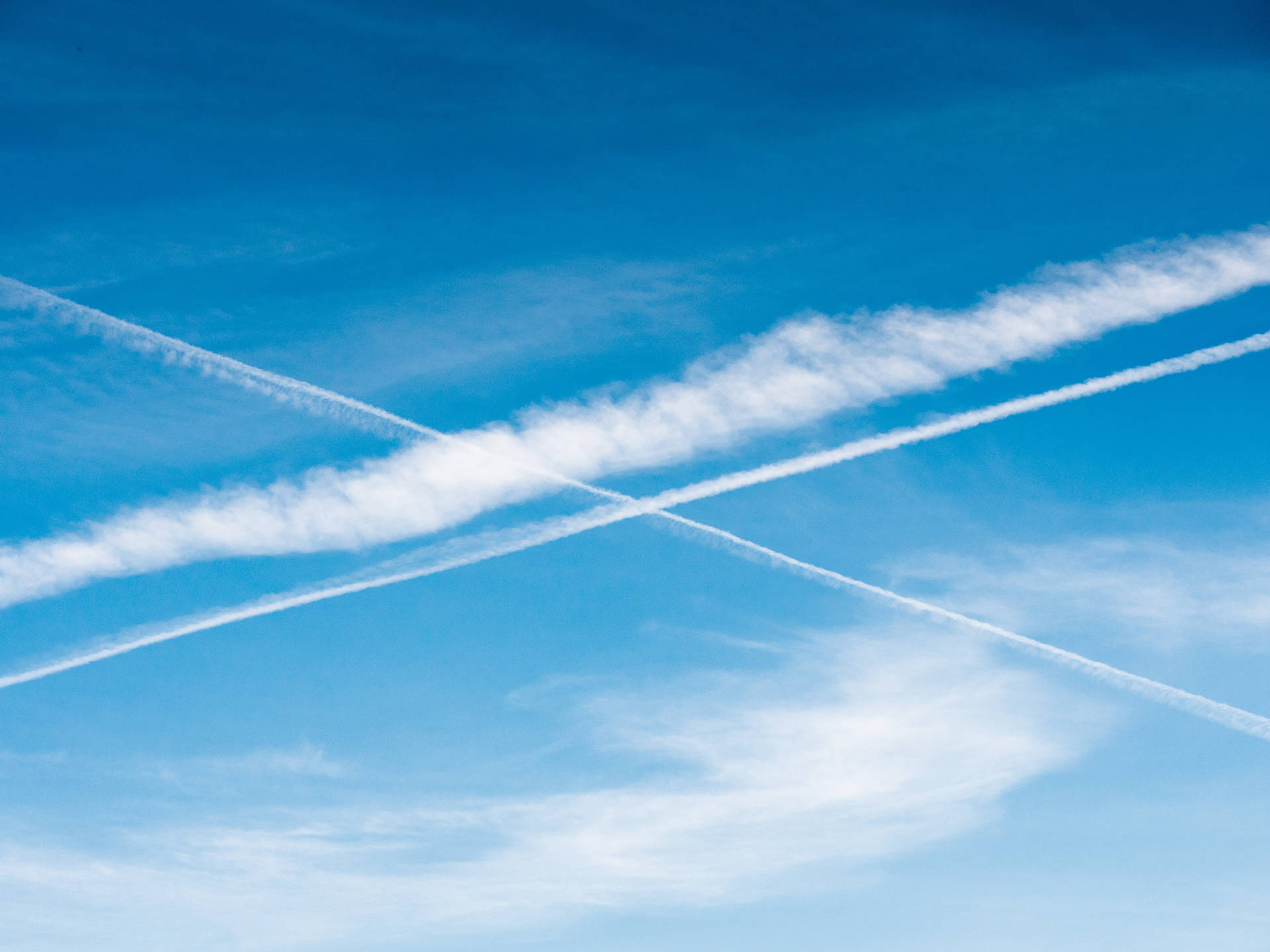 Plane Contrails In Azure Sky
