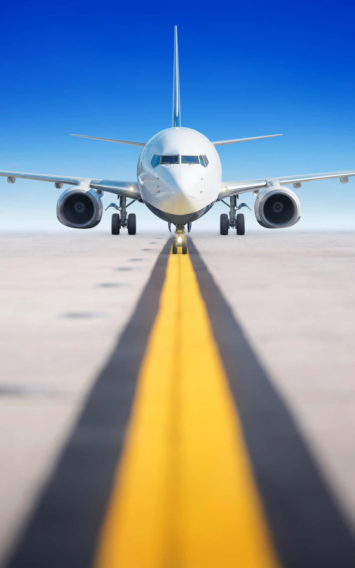 A Large Airplane Is On The Runway Wallpaper