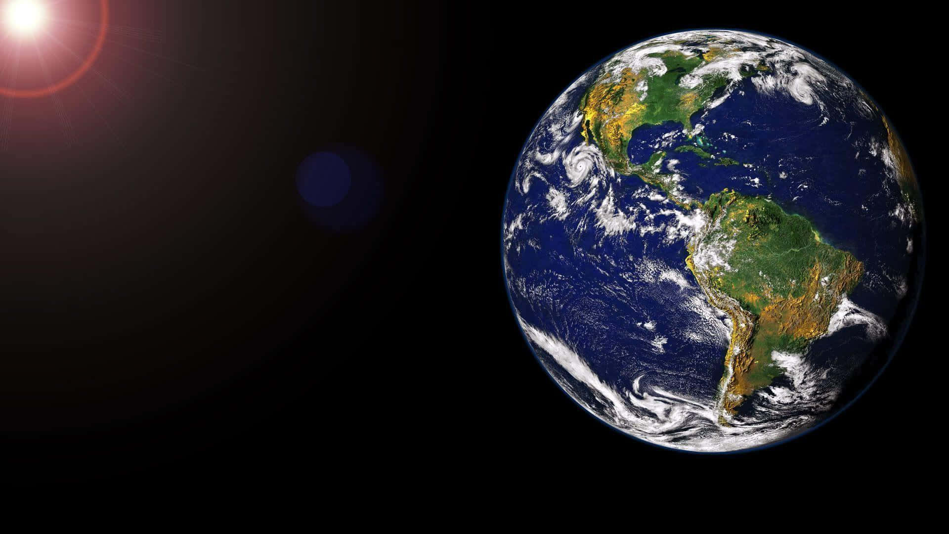Vårtblåa Hem: En Häpnadsväckande Utsikt Av Planeten Jorden Wallpaper