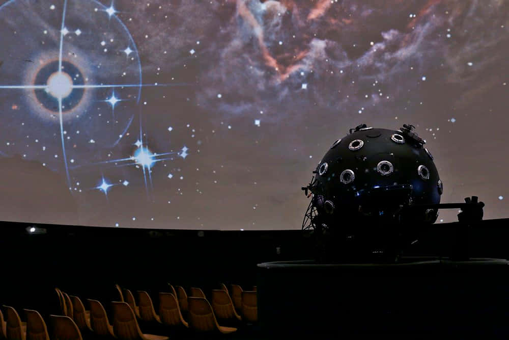 Exploring the Cosmos at the Planetarium Wallpaper