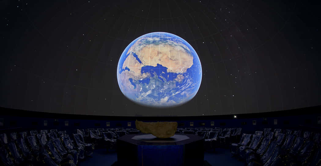 A Stunning Night at the Planetarium Wallpaper
