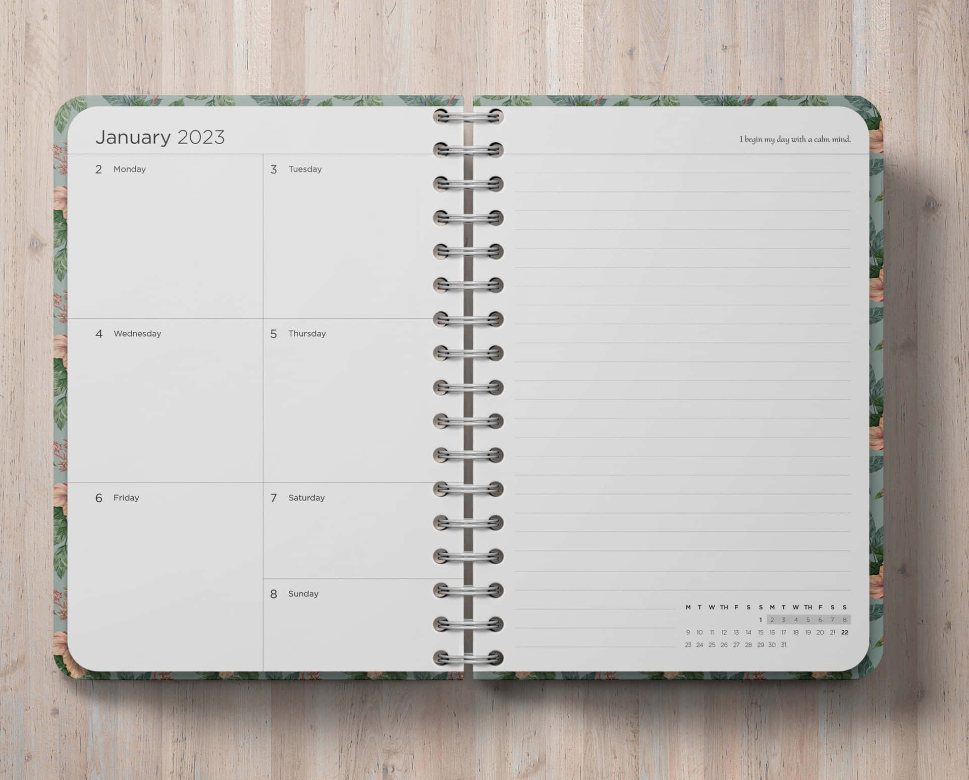 A Notebook With A Green Cover And A Calendar