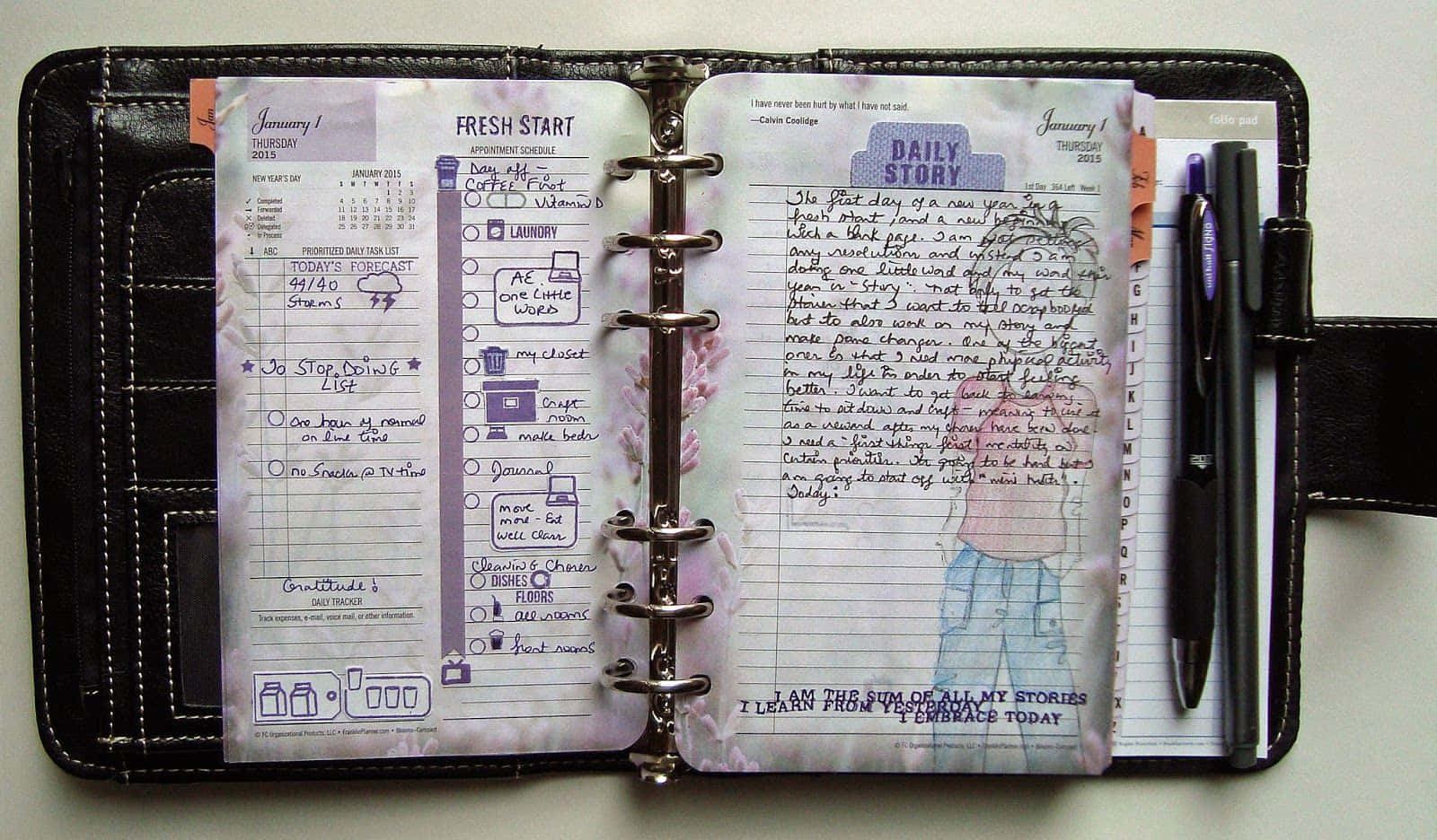 A Planner With A Pen And A Notebook