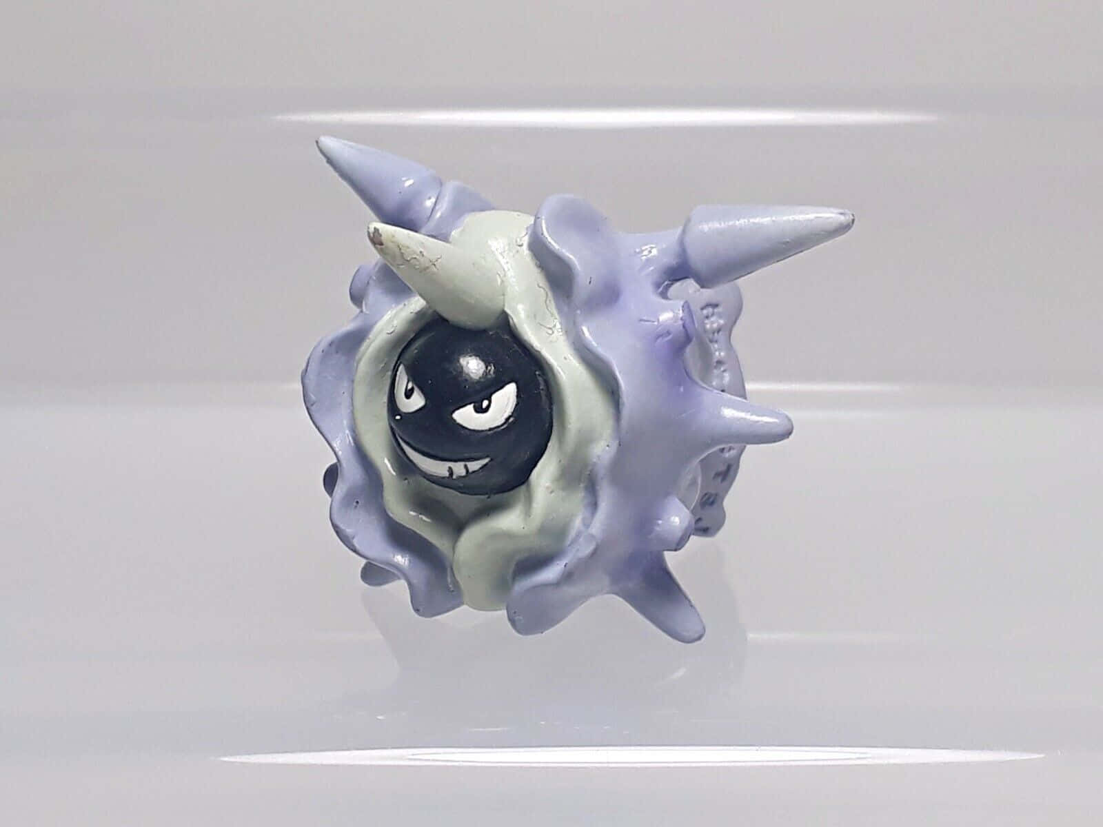 Close-up shot of a Plastic Cloyster Toy Wallpaper