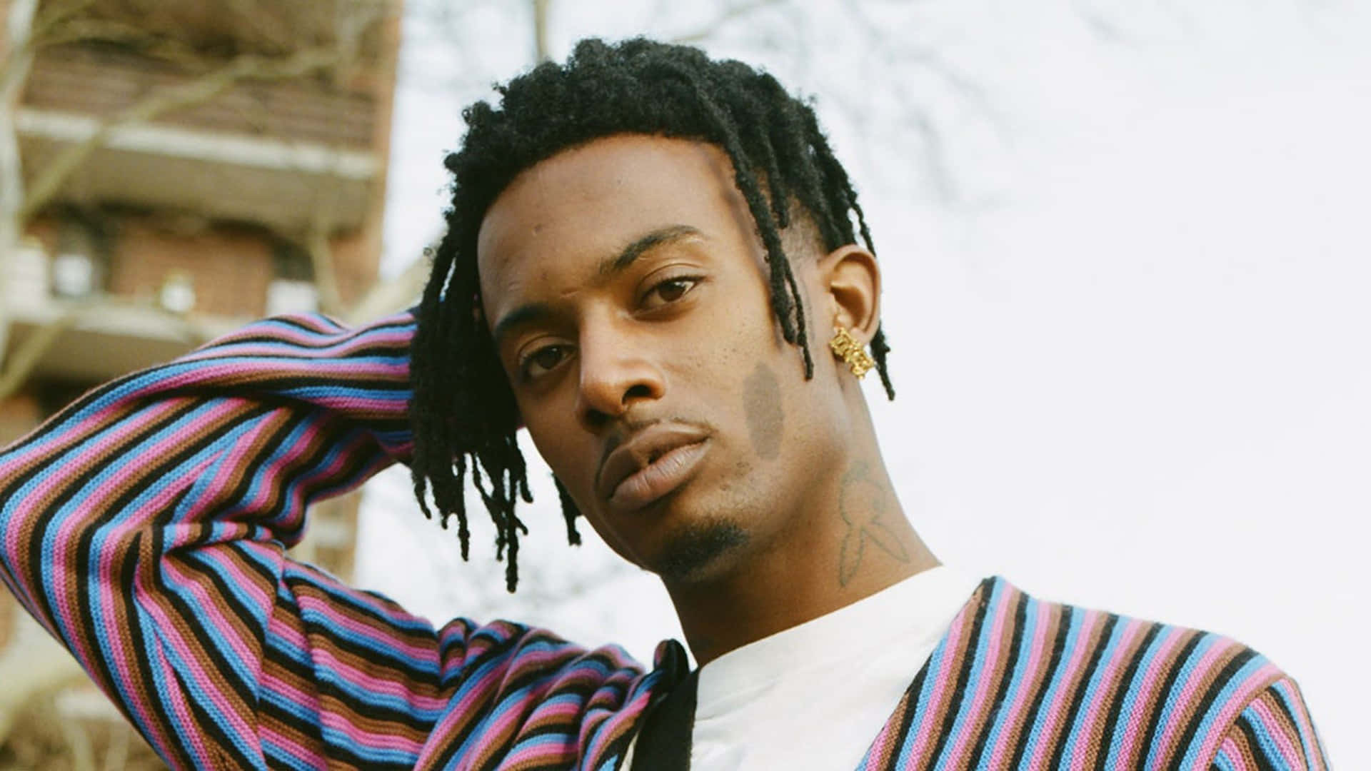 Playboi Carti shows off his signature style in this bright HD image Wallpaper