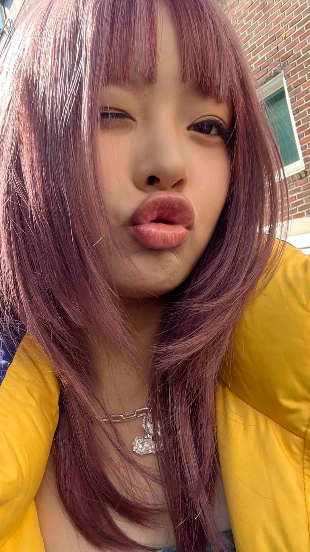 Playful Pout Selfiewith Purple Hair Wallpaper