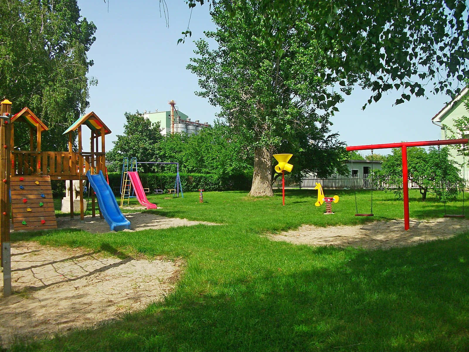 Colorful playground equipment in a vibrant park setting