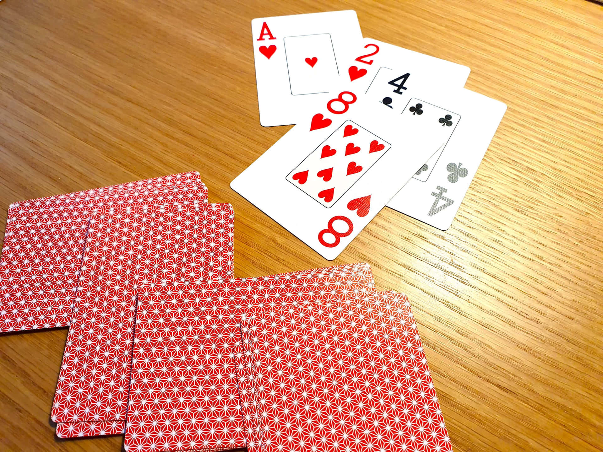 Playing Cardson Wooden Table Wallpaper