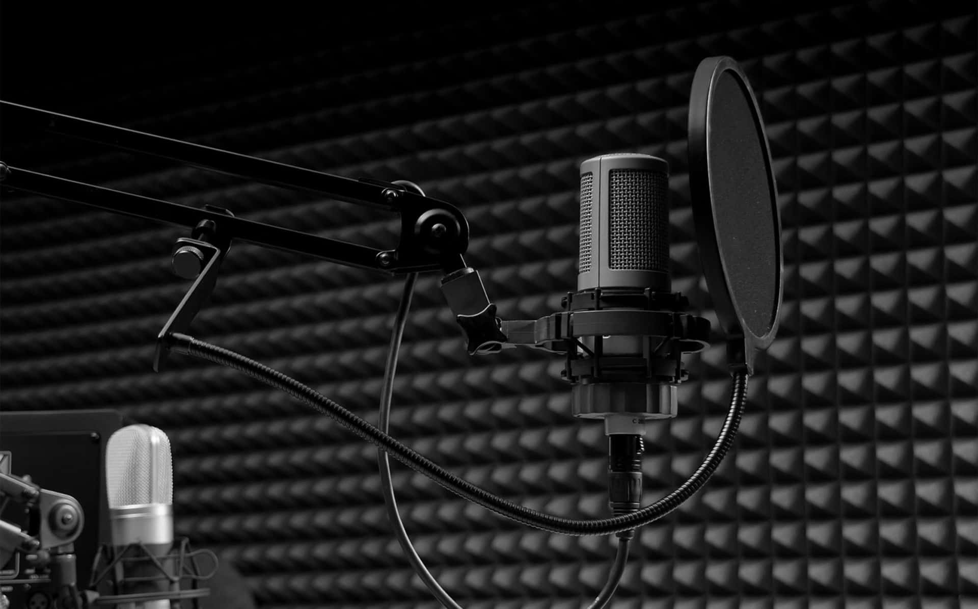 A Microphone And Recording Equipment In A Recording Studio