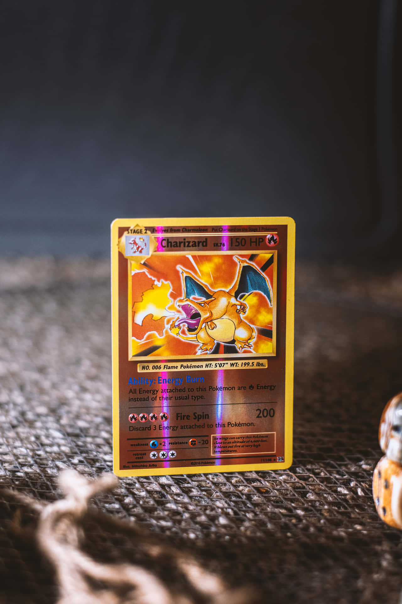 Pokemon Card On A Table With A Toy