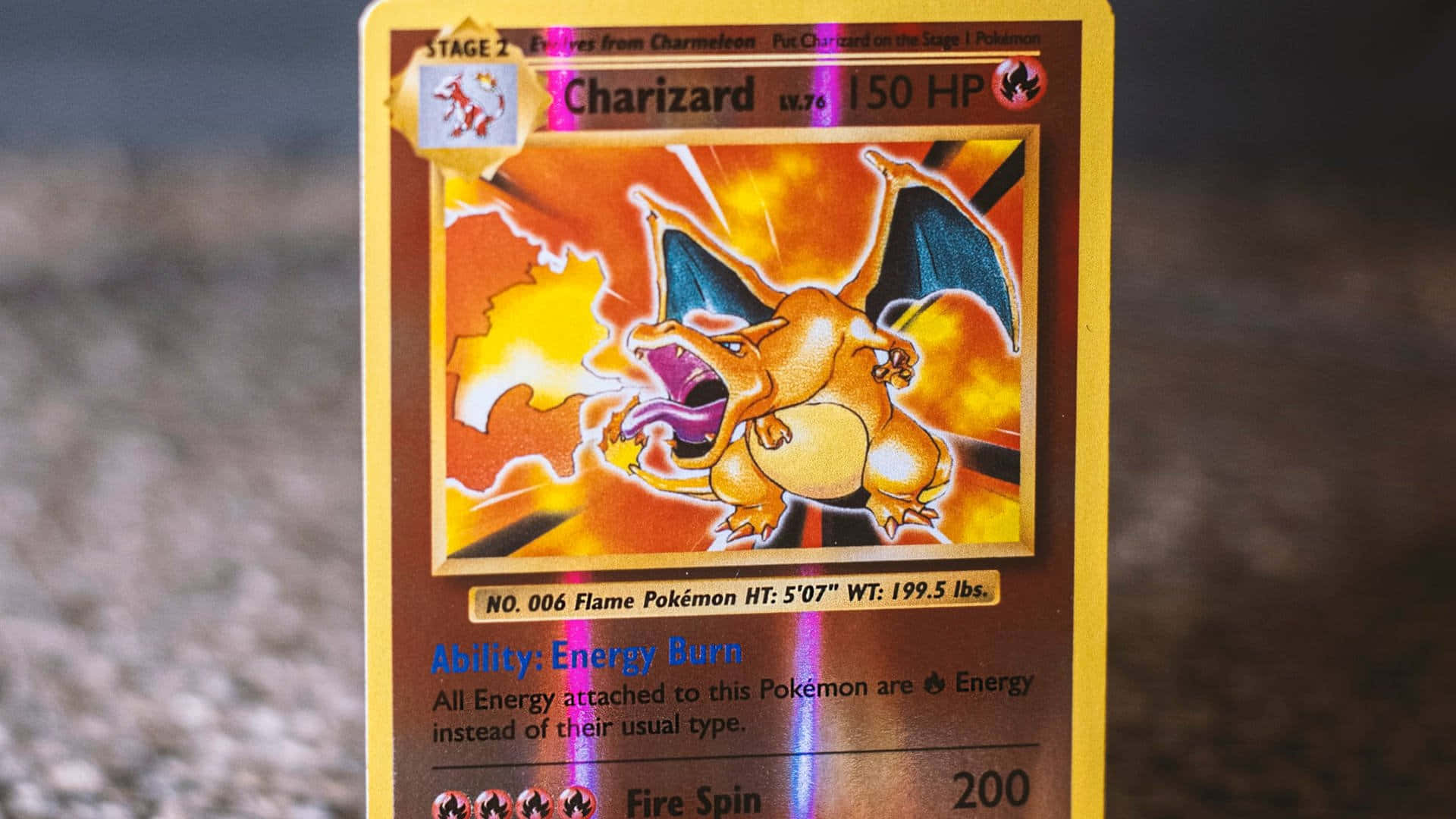 A Pokemon Card With A Fire Dragon On It