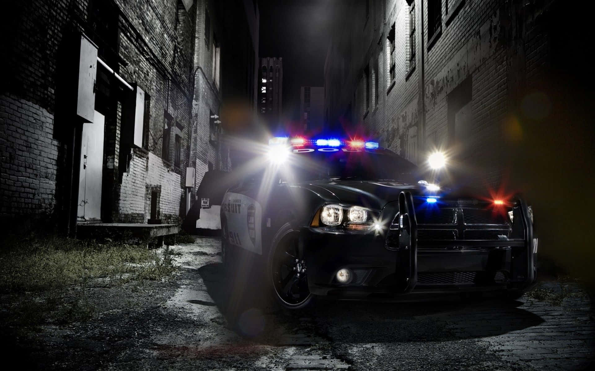 Police Car In An Alley At Night