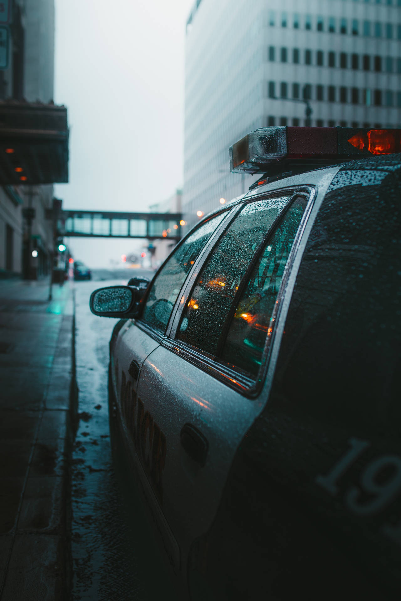 Police Car In Rain Wallpaper