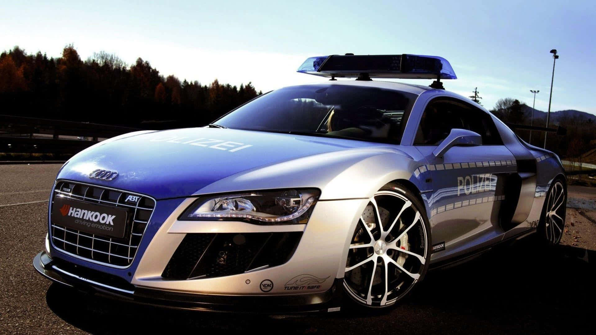 Sfondodela Polizia Con L'auto Audi R8.