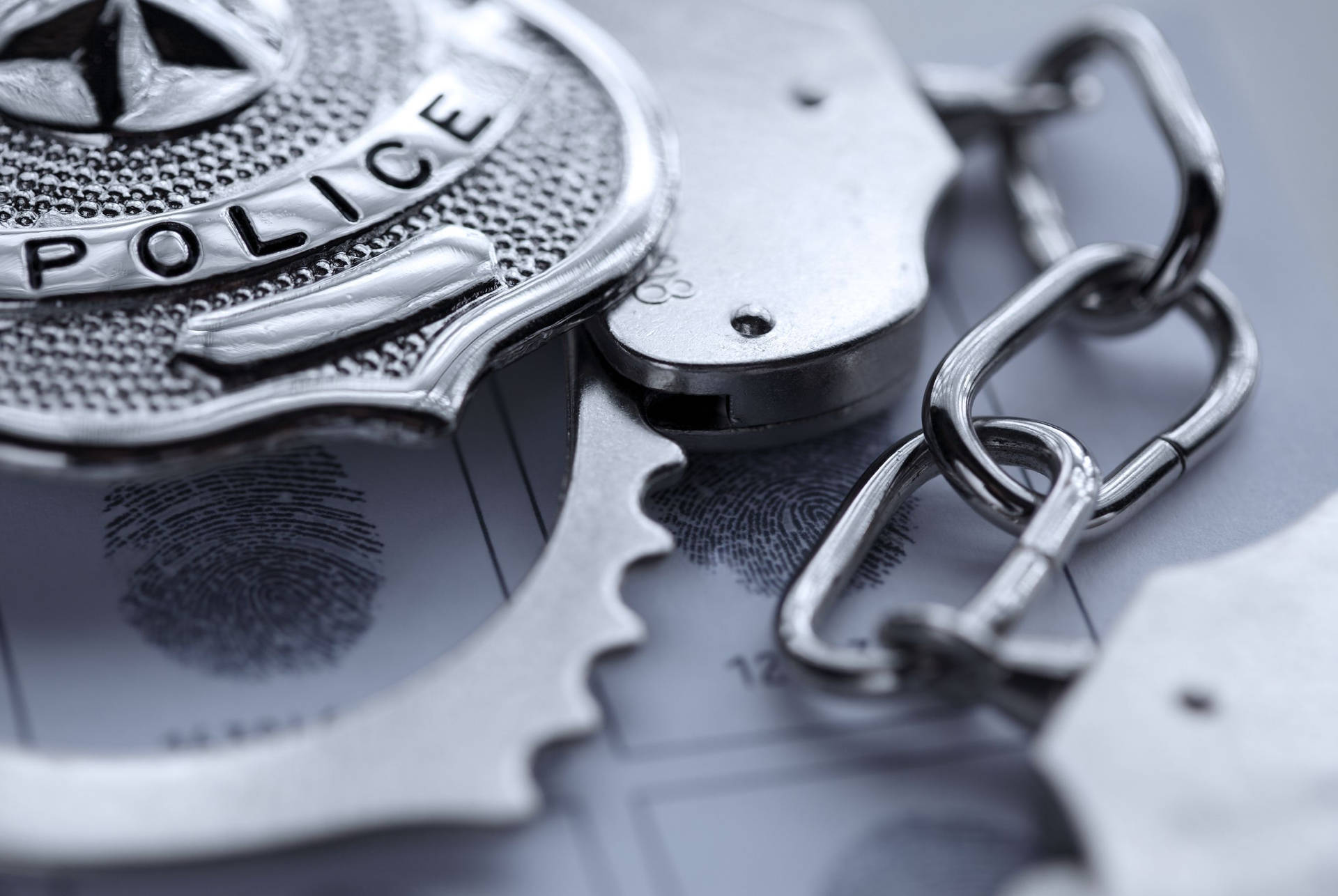 Police Officer Badge And Steel Handcuff Wallpaper