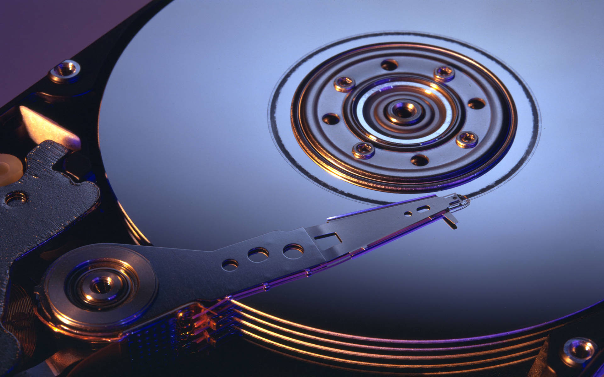 Caption: Inside View of a Polished Internal Computer Hard Drive Wallpaper