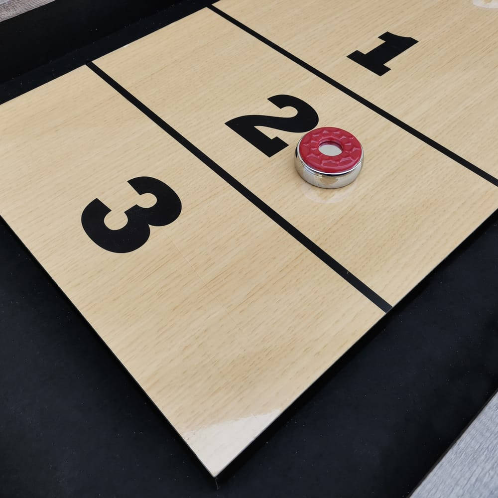 Intense Shuffleboard Game on Polished Wood Wallpaper