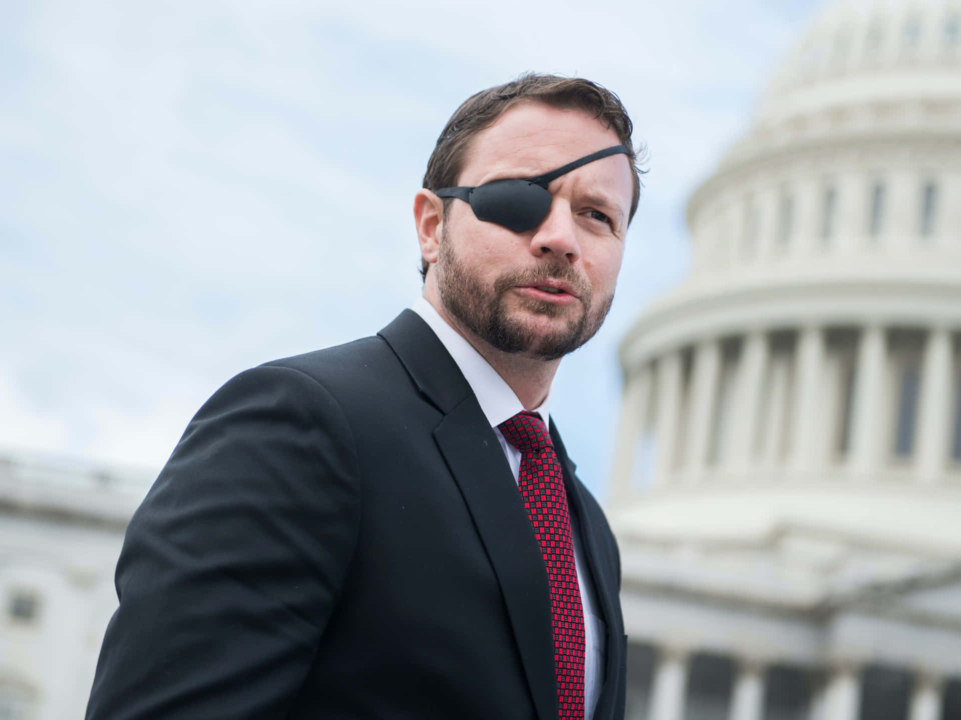 Politician With Eyepatch Near Capitol Wallpaper