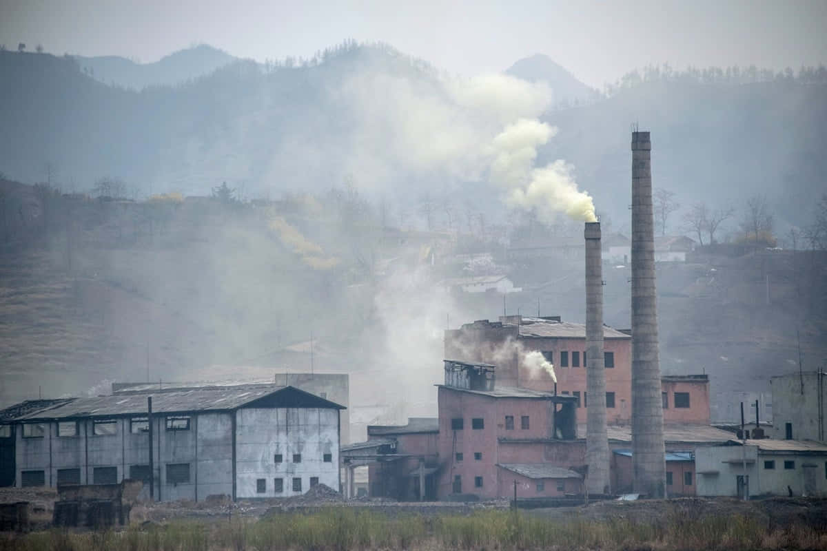 A Factory With Smoke Coming Out Of It