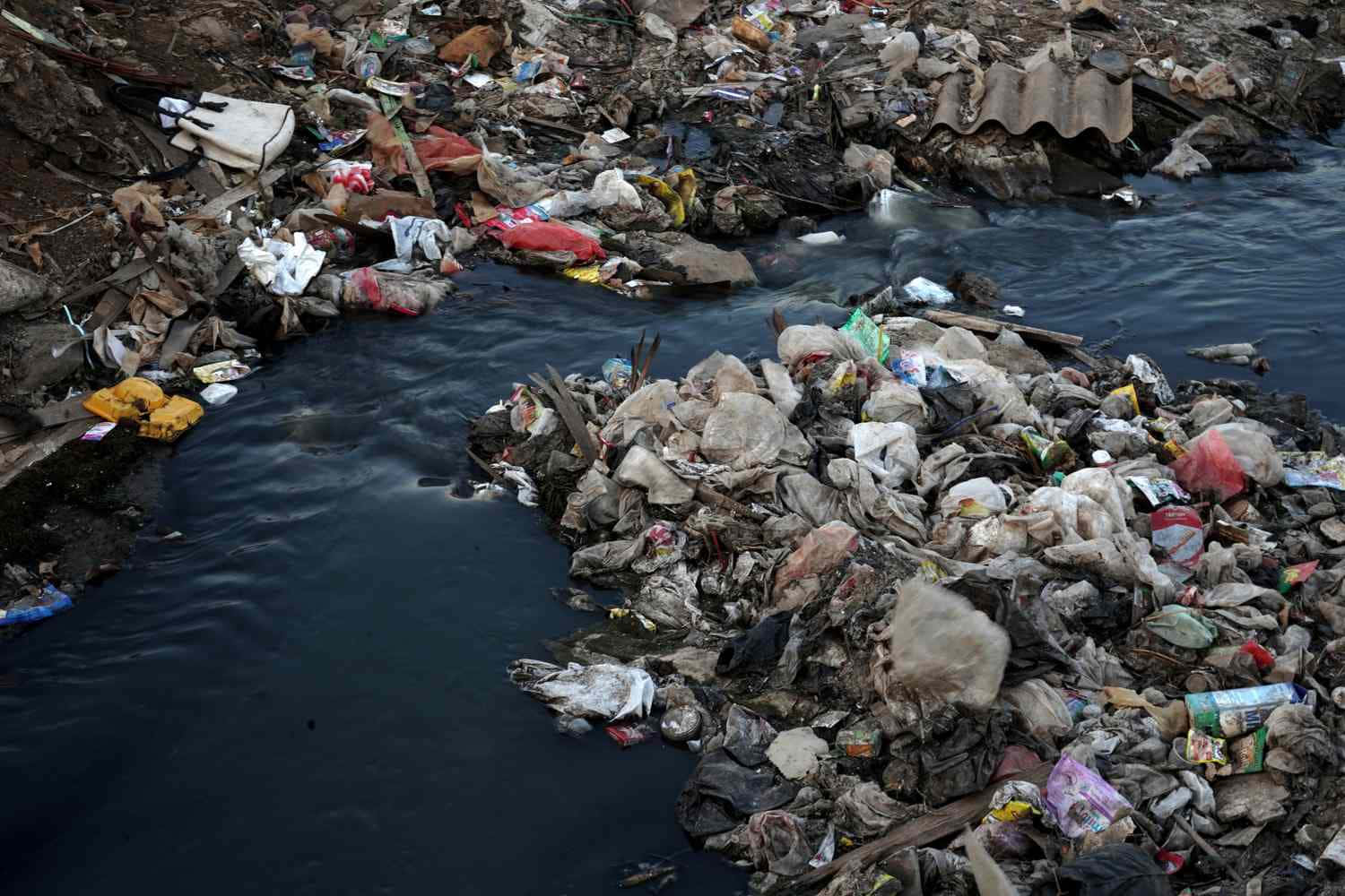 A River With Garbage And Trash In It