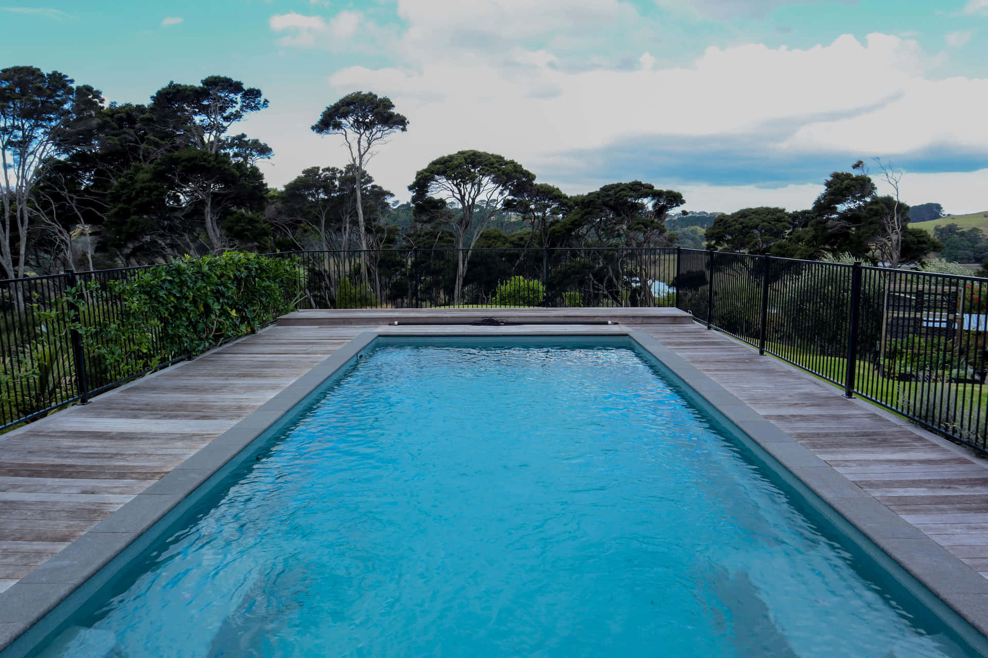 Rectangular Pool With Cloudy Sky View Picture
