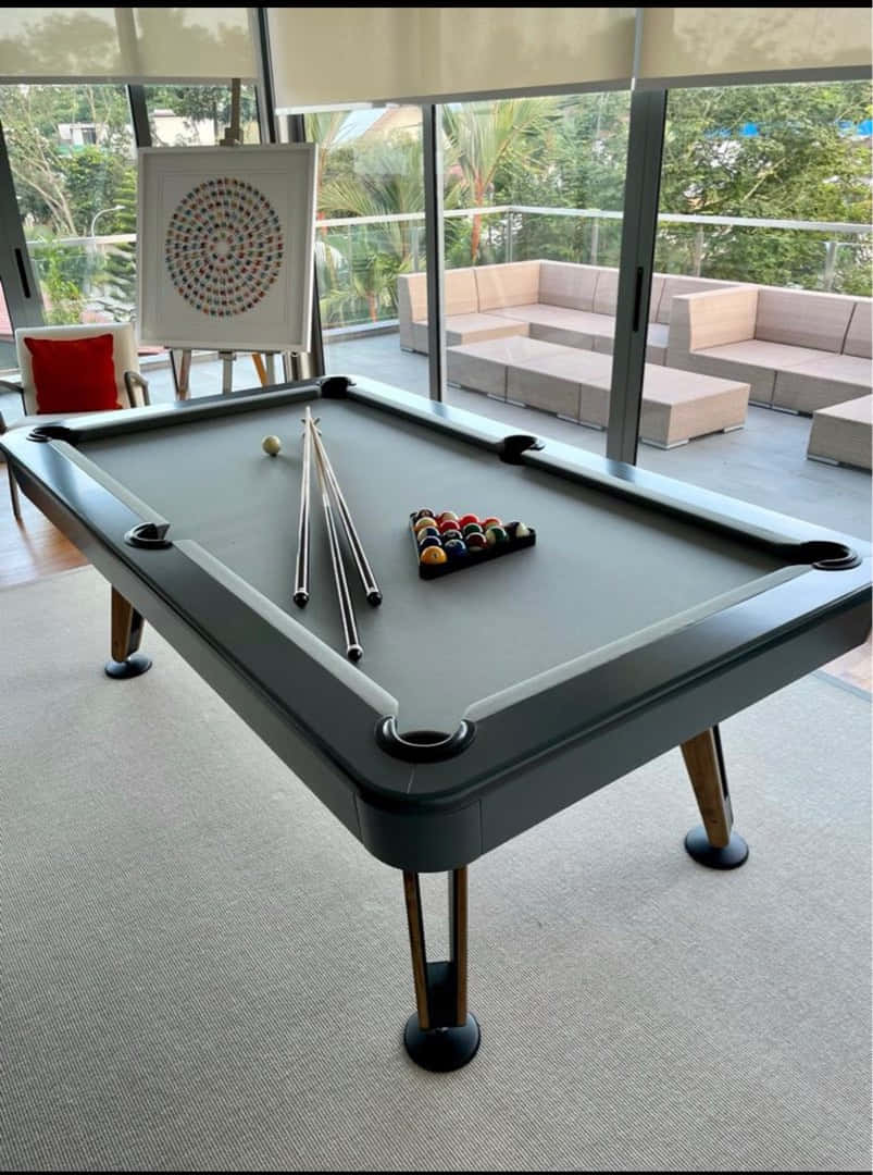 A Pool Table With A Pool Cue And A Billiard Ball